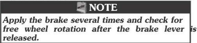 NOTE Apply the brake several times and check for free wheel rotation after the brake lever is released.