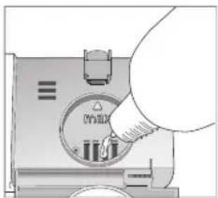 Diagram showing a hand inserting a component into a device with labeled parts and symbols
