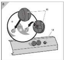 Diagram of a mechanical device with labeled parts 11 and 12, showing components like gears and rotating parts.