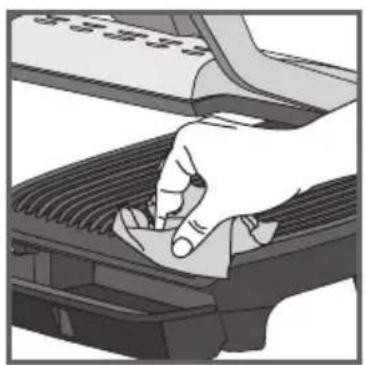 Illustration of a hand pressing down on a mechanical component (no text or symbols visible)
