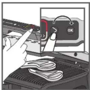 Diagram showing a hand pressing a button labeled 'OK' with arrows and a tool on the cover, indicating action or process.