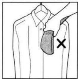Diagram showing a hand holding a shirt with a shaded bag and a cross mark indicating a specific area.