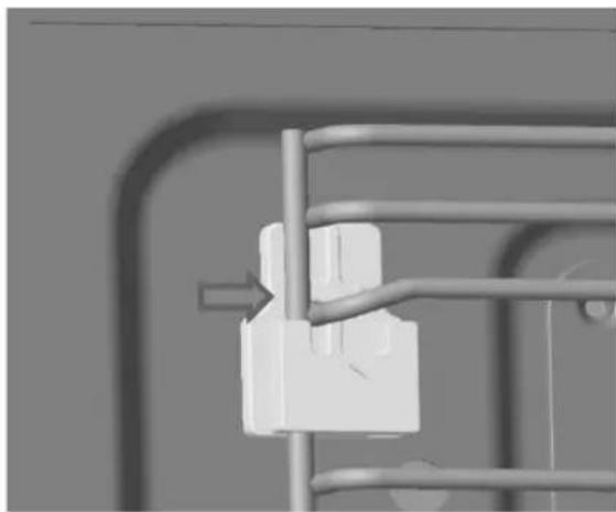 Close-up of a white mechanical component mounted on a metal frame, no visible text or symbols