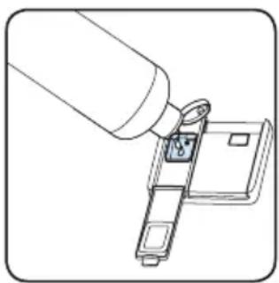 Line drawing of a hand inserting a small component into a device (no text or symbols).