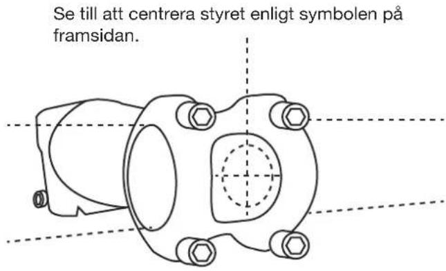 Se till att centrera styret enligt symbolen på framsidan.