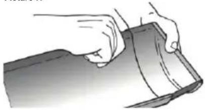 Illustration of hands holding a flat sheet of paper (no text or symbols visible)