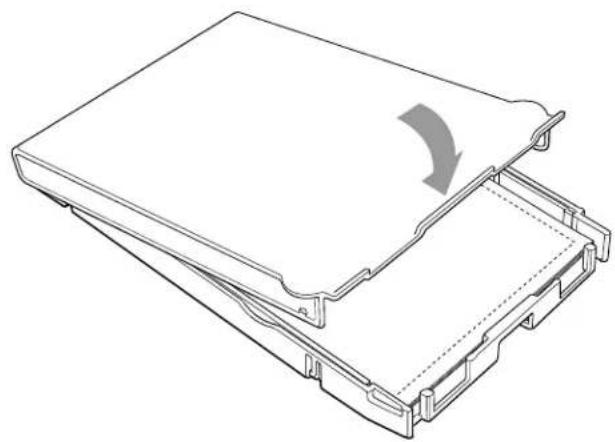 Technical line drawing of a mechanical device with a curved arrow indicating rotation or movement (no text or symbols present)
