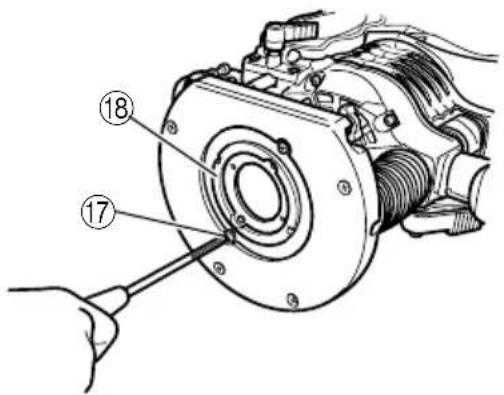 Technical diagram of a mechanical assembly with numbered parts, likely for repair or maintenance instructions.