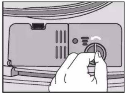 Illustration of a hand pressing down on a device panel with a knob (no text or symbols visible)