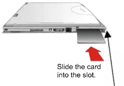 Slide the card into the slot.