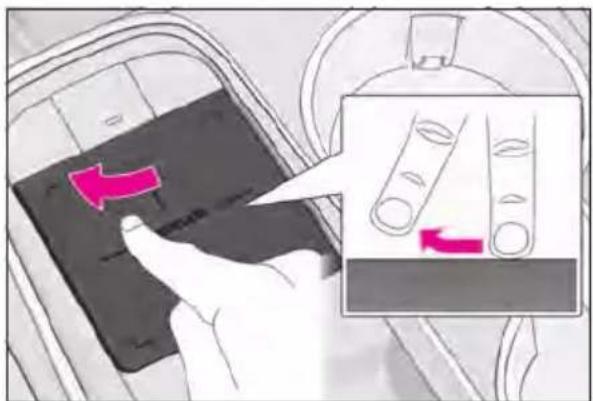 Diagram showing a hand pressing a black object with a pink arrow, alongside an inset image of two test tubes with red arrows indicating movement.