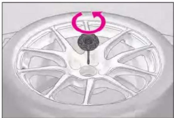 LEXUS RC F (2024) - Loosen the center fastener that secures the spare tire. - 1
