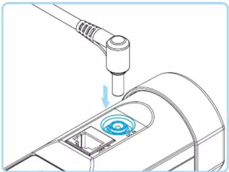 Technical diagram showing a device with labeled ports and a blue circular component, indicating a process or operation.