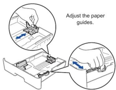 Adjust the paper guides.