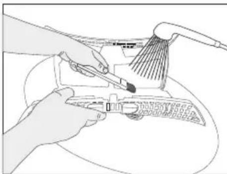Illustration of hands using a power tool to clean or install electronic components (no text or symbols visible)