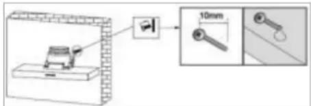 Diagram showing a mechanical setup with a spring scale and a magnified view of a 10mm component, likely illustrating a measurement or assembly process.