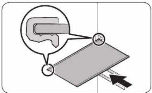Diagram illustrating a mechanical or optical setup with labeled components and directional arrows, including a magnified inset showing a component being pointed out.