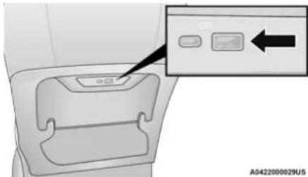 Diagram of a car interior with labeled buttons and an arrow pointing to a button, likely indicating a directional or action indicator.