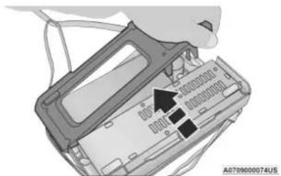 Diagram showing a device with labeled components and an arrow pointing to a component, likely indicating a status or operation.