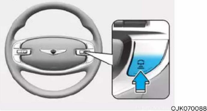 Diagram showing car steering wheel and dashboard with a blue speed limit indicator and arrow pointing to the dashboard.