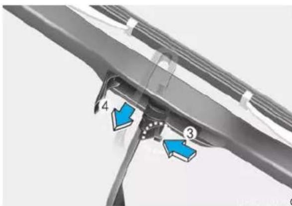 Technical diagram showing a mechanical component with numbered parts and blue arrows indicating features or points of interest.