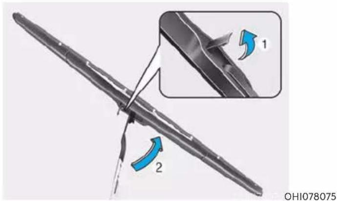 Technical diagram showing a mechanical component with labeled parts and directional arrows indicating motion or movement.