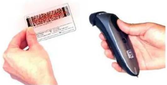 Hand holding a barcode card and scanning a QR code scanner, both showing text and digital interface elements.