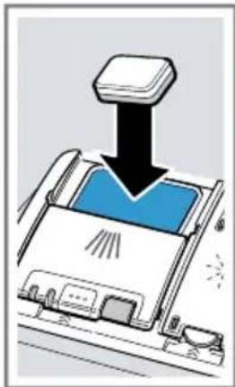 Diagram of a printer with paper feeding into a tray, showing liquid level (no text or symbols).