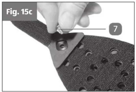 Close-up of a hand using a tool to cut a circular perforated material, labeled 'Fig. 15c' and marked with number 7 (no text or symbols on the object itself)