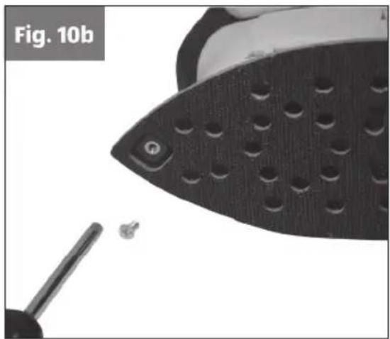 Close-up of a black textured surface with a screwdriver inserted, labeled Fig. 10b (no text or symbols on the object itself)