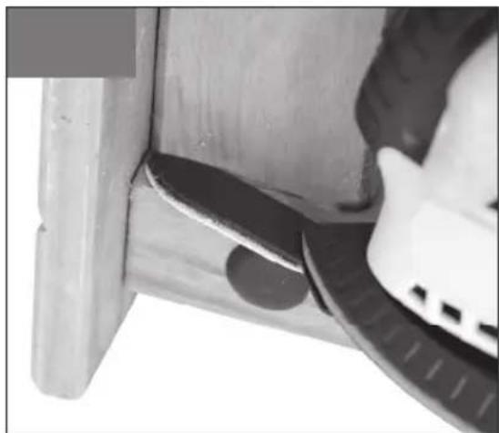 Close-up of a mechanical component with a curved edge and a small circular feature, no visible text or symbols.