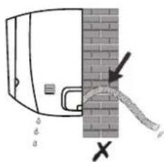 Diagram showing a pipe or pipe passing through a brick wall with directional arrows and a cross mark indicating failure or damage.