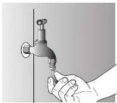 Illustration of a hand holding a faucet against a vertical wall (no text or symbols)
