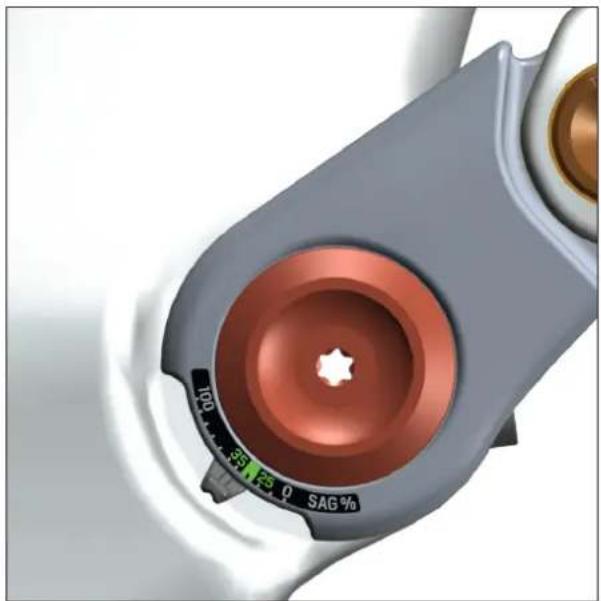 Close-up of a mechanical component with a red circular top and black scale dial (no visible text or symbols)