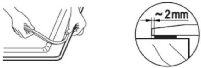 Technical diagram showing a hand holding a cable with a magnified detail indicating approximately 2 mm width.