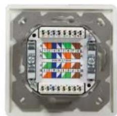 Close-up of a small electronic component with a grid pattern on its surface (no visible text or symbols)