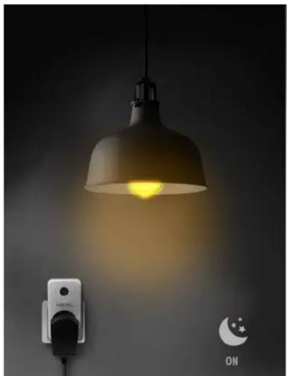 Light bulb with glowing effect on wall, next to a wall-mounted switch and night sky icon (no text or symbols)
