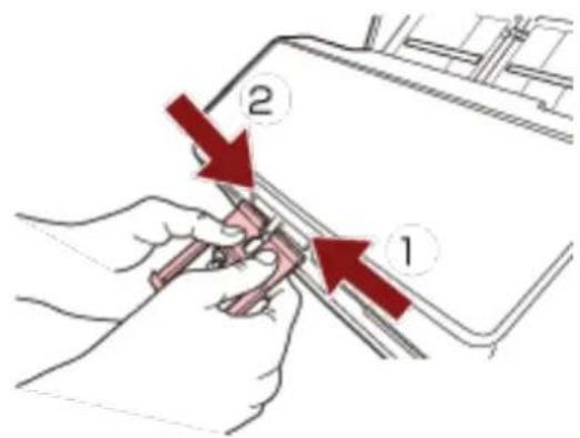 Diagram showing two labeled parts (1 and 2) with red arrows indicating direction of movement or process, likely illustrating a mechanical or electrical component.