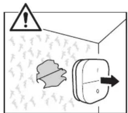 Warning sign with warning triangle, leaf symbol, and directional arrow on a wall