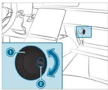 Diagram showing car interior control with labeled parts and directional arrows indicating rotation or adjustment