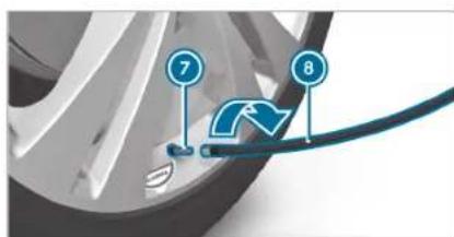 Diagram showing car wheel components with numbered labels 7 and 8 pointing to a blue curved arrow on a cable.