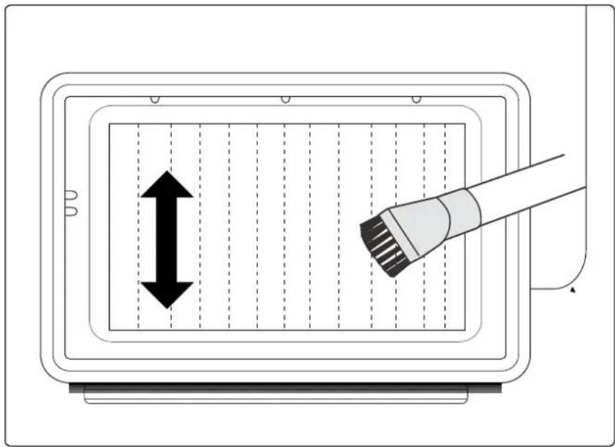 Diagram showing a device with a brush applying force to a grid, indicating vertical displacement or force direction.