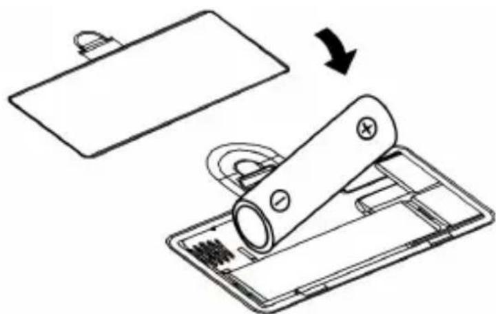 Diagram showing a battery being placed on a tray with a magnified view of its internal components (no text or symbols present)