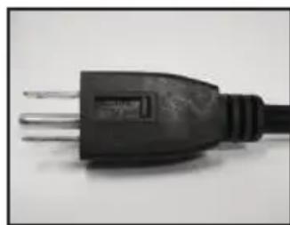 Close-up of a black electrical outlet plug with three leads (no text or symbols visible)
