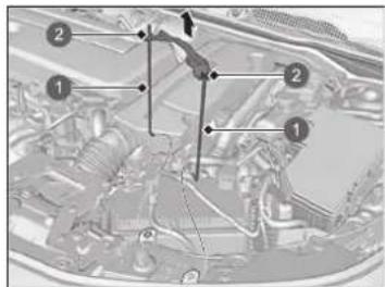 Technical diagram of an automotive engine bay with numbered components and directional arrows indicating flow or movement.