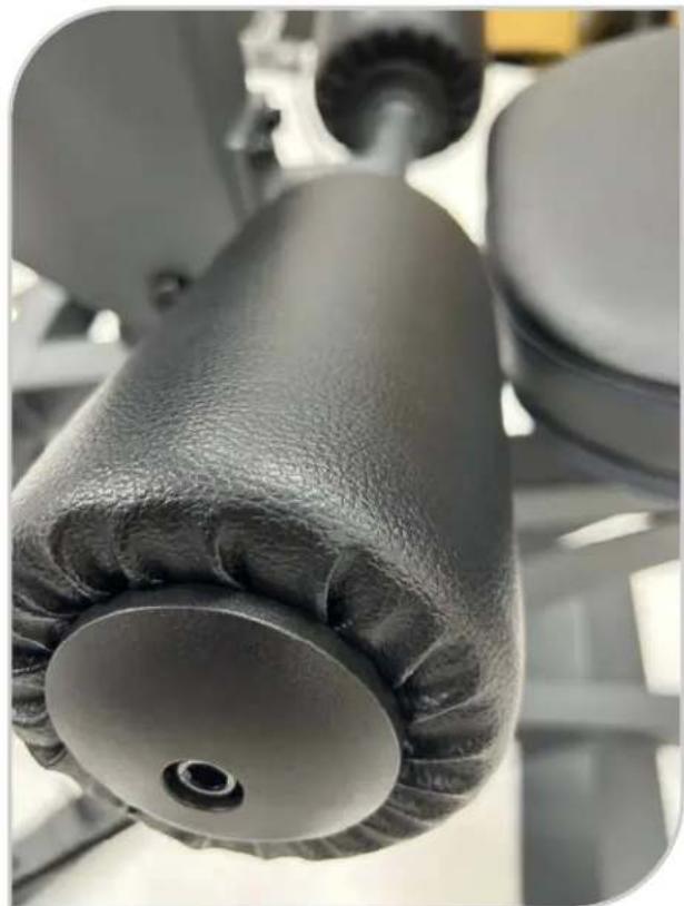 Close-up of a mechanical component with textured surface and circular base (no visible text or symbols)
