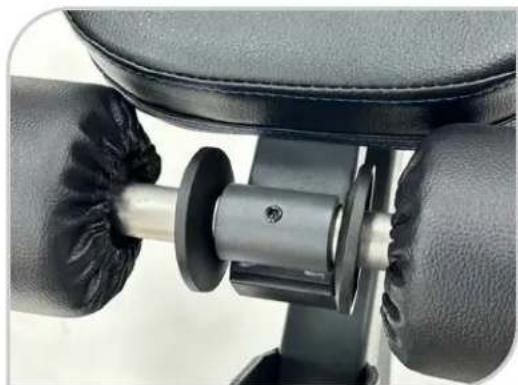Close-up of a mechanical assembly with a metallic component inserted into a black seat (no visible text or symbols)