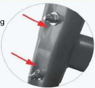 Close-up of a mechanical component with two red arrows pointing to features (no text or symbols visible)