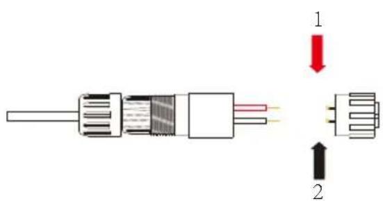 Diagram of a cable connector with labeled parts and directional arrows indicating assembly or movement.