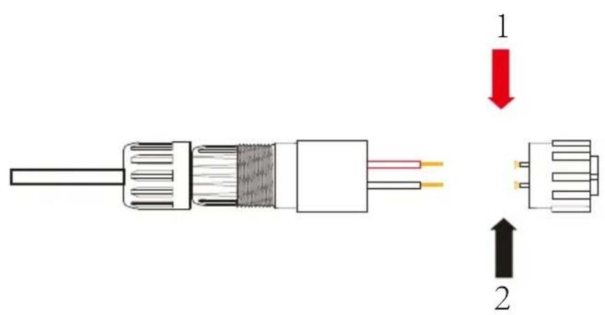 Diagram of a cable connector with labeled parts and directional arrows indicating assembly or connection.